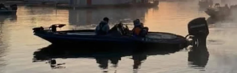 Vexus bass boat on a Midwest lake before a tournament — fiberglass hull stress is common on high-performance bass boats
