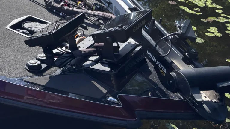 Minn Kota Ultrex trolling motor mounted on a boat bow beside Humminbird fish finder displays
